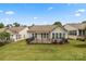 A home's back exterior boasts a large deck and fenced yard, ideal for outdoor enjoyment and entertaining at 56119 Finches Ct, Indian Land, SC 29707