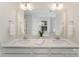 Bright bathroom featuring double sinks, quartz counters, and a well-lit mirror, creating a functional space at 635 R L Stowe Rd, Belmont, NC 28012