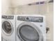 Laundry room with front-load washer and dryer, plus shelf for storing laundry essentials at 635 R L Stowe Rd, Belmont, NC 28012