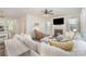 Bright living room boasts a fireplace, plush sectional sofa, and a view of the adjacent dining area at 635 R L Stowe Rd, Belmont, NC 28012