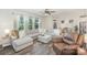 Spacious living room with a large sectional sofa, leather chair, and plenty of natural light at 635 R L Stowe Rd, Belmont, NC 28012