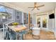 Covered outdoor patio includes a ceiling fan and varied seating options for entertaining or relaxation at 635 R L Stowe Rd, Belmont, NC 28012