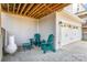 Covered patio with Adirondack chairs and a small table, ideal for relaxing outdoors at 635 R L Stowe Rd, Belmont, NC 28012