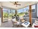 Relaxing screened porch with ceiling fan and comfortable seating, perfect for enjoying the outdoors at 635 R L Stowe Rd, Belmont, NC 28012