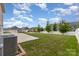 The backyard features a well-maintained lawn, a concrete patio, and a white privacy fence for outdoor enjoyment at 732 Altamonte Dr, Clover, SC 29710