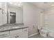 Bright bathroom featuring gray tile floors, white vanity, a large mirror, and a shower-tub combination at 732 Altamonte Dr, Clover, SC 29710