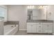 En suite bathroom featuring double sinks, a granite countertop, and a large tub at 732 Altamonte Dr, Clover, SC 29710