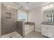Beautiful bathroom with gray tiled walk-in shower and soaking tub with large window at 732 Altamonte Dr, Clover, SC 29710