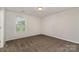 A spacious bedroom with plush carpet, neutral walls, and lots of natural light at 732 Altamonte Dr, Clover, SC 29710