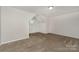Attic bedroom with a window for natural light and neutral paint and carpet at 732 Altamonte Dr, Clover, SC 29710