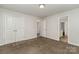 Bright bedroom features neutral walls, carpeting, and closet with a view to the en suite bathroom at 732 Altamonte Dr, Clover, SC 29710