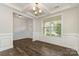 Dining room with dark wood floors, modern light fixture and a view out the window at 732 Altamonte Dr, Clover, SC 29710