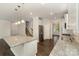Modern kitchen with granite countertops, stainless steel appliances, dark wood floors and an island with pendant lighting at 732 Altamonte Dr, Clover, SC 29710