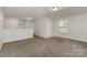 Neutral living room featuring neutral paint, carpet, and a window to let in natural light at 732 Altamonte Dr, Clover, SC 29710