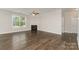Bright living room with a cozy fireplace, hardwood floors, and ample natural light at 732 Altamonte Dr, Clover, SC 29710
