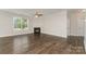 Bright living room with a cozy fireplace, hardwood floors, and ample natural light at 732 Altamonte Dr, Clover, SC 29710