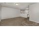 Spacious living room with neutral paint, carpet, and a view of the staircase at 732 Altamonte Dr, Clover, SC 29710