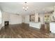 Expansive living space featuring hardwood floors, a fireplace, a modern kitchen, and lots of natural light at 732 Altamonte Dr, Clover, SC 29710