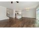 Open-concept living space with hardwood floors, white kitchen, and ample natural light at 732 Altamonte Dr, Clover, SC 29710