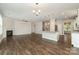 Expansive living space featuring hardwood floors, a fireplace, a modern kitchen, and lots of natural light at 732 Altamonte Dr, Clover, SC 29710