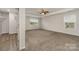 Spacious main bedroom featuring neutral walls, carpeting and multiple windows for natural light at 732 Altamonte Dr, Clover, SC 29710