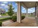 Inviting porch with decorative columns and landscaping, offering a relaxing outdoor space at 732 Altamonte Dr, Clover, SC 29710