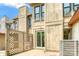 An exterior view of the back patio with a sliding door, lattice privacy fence and air conditioning unit at 7912 Charter Oak Ln, Charlotte, NC 28226