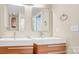 Modern bathroom featuring dual sinks and stylish fixtures at 7912 Charter Oak Ln, Charlotte, NC 28226