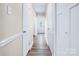 Clean hallway that leads to the front door at 7912 Charter Oak Ln, Charlotte, NC 28226