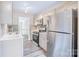 Stylish kitchen featuring stainless steel appliances and modern backsplash design at 7912 Charter Oak Ln, Charlotte, NC 28226