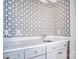 Elegant wet bar area with custom tile work and modern countertops at 7912 Charter Oak Ln, Charlotte, NC 28226