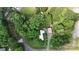 Aerial view of a home with mature trees surrounding a long, shaded driveway at 8112 Blackwood Rd, Denver, NC 28037
