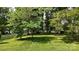 Lovely yard with mature trees and green grass at 8112 Blackwood Rd, Denver, NC 28037