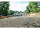 Expansive backyard featuring a brand new fence, lush trees, and a beautiful in-ground pool at 932 Shady Bluff Dr, Charlotte, NC 28211