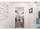 Hallway entryway featuring clear view into living spaces with wood beams and wood flooring at 932 Shady Bluff Dr, Charlotte, NC 28211