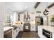 Gourmet kitchen featuring stainless steel appliances, white cabinets, and ample counter space at 932 Shady Bluff Dr, Charlotte, NC 28211