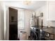 Laundry room with modern appliances, including washer, dryer, and clothing care system at 932 Shady Bluff Dr, Charlotte, NC 28211