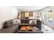 Spacious living room with wet bar, wine storage, and comfortable seating arrangement at 932 Shady Bluff Dr, Charlotte, NC 28211