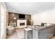 Comfortable living room with gas fireplace, wood accent wall, and recessed lighting at 932 Shady Bluff Dr, Charlotte, NC 28211