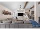 Cozy living room featuring exposed wooden beams, recessed lighting, and a large sectional sofa at 932 Shady Bluff Dr, Charlotte, NC 28211