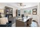 Office featuring gray built-ins, a glass-top desk, and a window with natural light at 932 Shady Bluff Dr, Charlotte, NC 28211