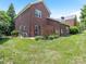 Spacious backyard showing exterior with patio and lush lawn at 9451 Bonnie Briar Cir, Charlotte, NC 28277