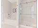 Modern bathroom featuring a soaking tub and glass-enclosed shower at 9451 Bonnie Briar Cir, Charlotte, NC 28277