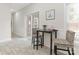 Bright breakfast nook with table, chairs, and sliding glass door leading to the backyard at 9451 Bonnie Briar Cir, Charlotte, NC 28277
