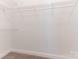 Walk-in closet with white wire shelving, ready for organization and storage at 9451 Bonnie Briar Cir, Charlotte, NC 28277