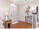 Inviting entryway with hardwood floors, stylish decor, and staircase at 9451 Bonnie Briar Cir, Charlotte, NC 28277
