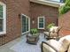 Private outdoor patio with comfortable seating and a view of the surrounding greenery at 9451 Bonnie Briar Cir, Charlotte, NC 28277