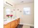 Bright bathroom featuring a double vanity with a large mirror, and neutral colors at 1006 Apogee Dr, Indian Trail, NC 28079
