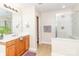 Bathroom featuring a glass-door shower, a vanity with a sink, and a view into the toilet area at 1006 Apogee Dr, Indian Trail, NC 28079