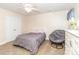 Bedroom featuring a comfortable bed, chair, and a dresser with a vanity mirror at 1006 Apogee Dr, Indian Trail, NC 28079